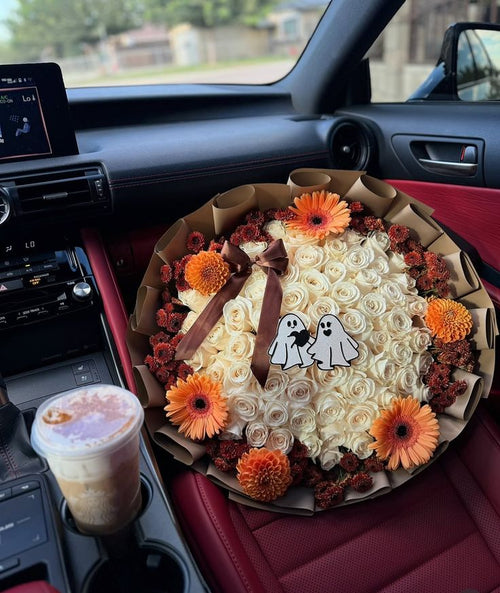 50 white roses fall theme around rim with boo topper